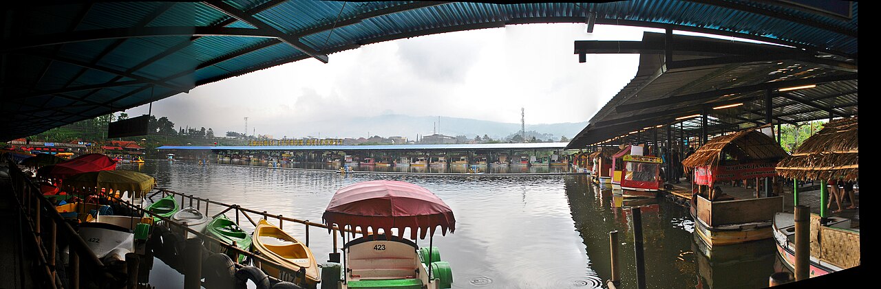 Traditional food canoes moored along the boardwalk at Floating Market Lembang