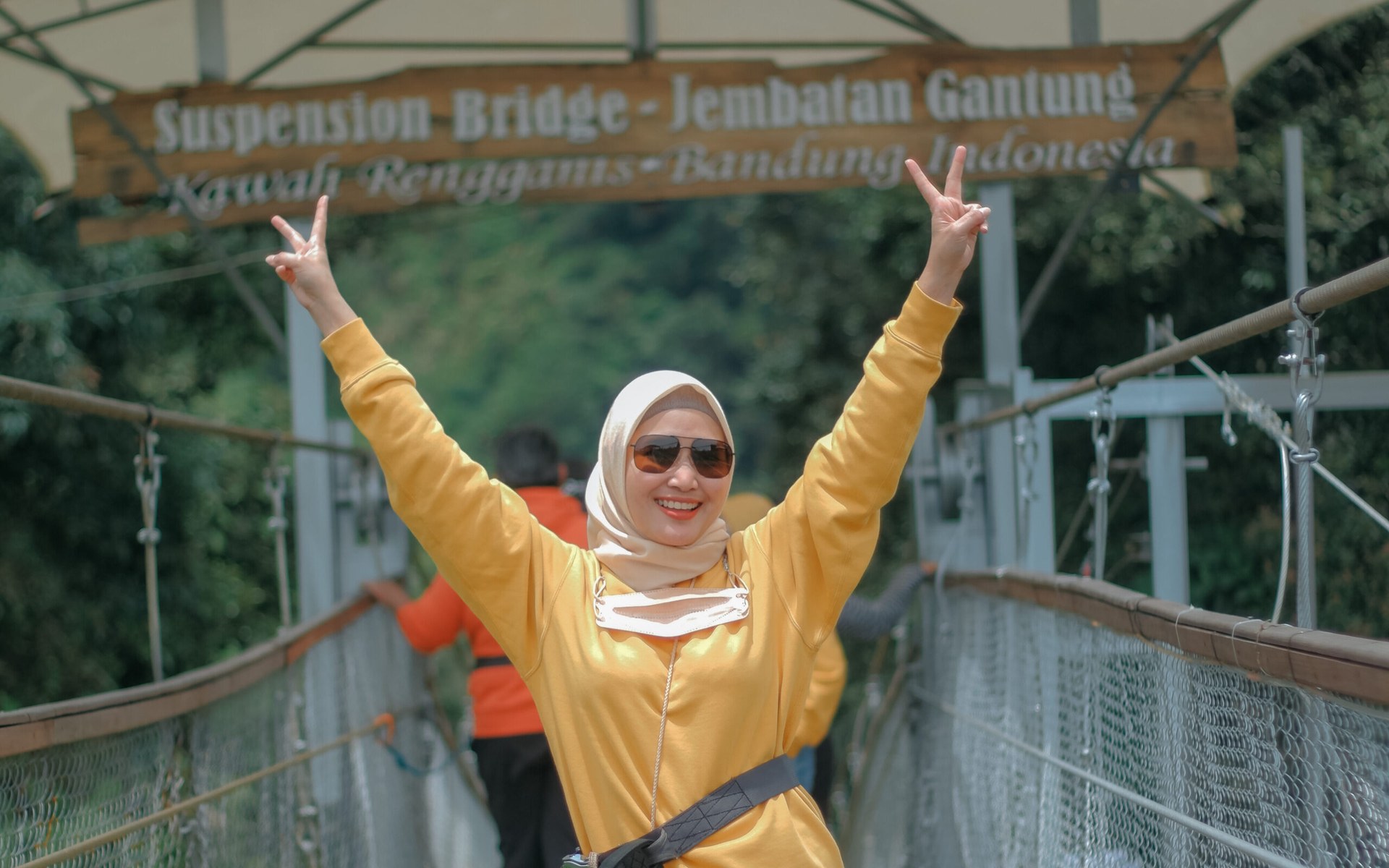 The monumental 370-meter Rengganis Suspension Bridge hanging high above the river gorge and tea valleys in Ciwidey