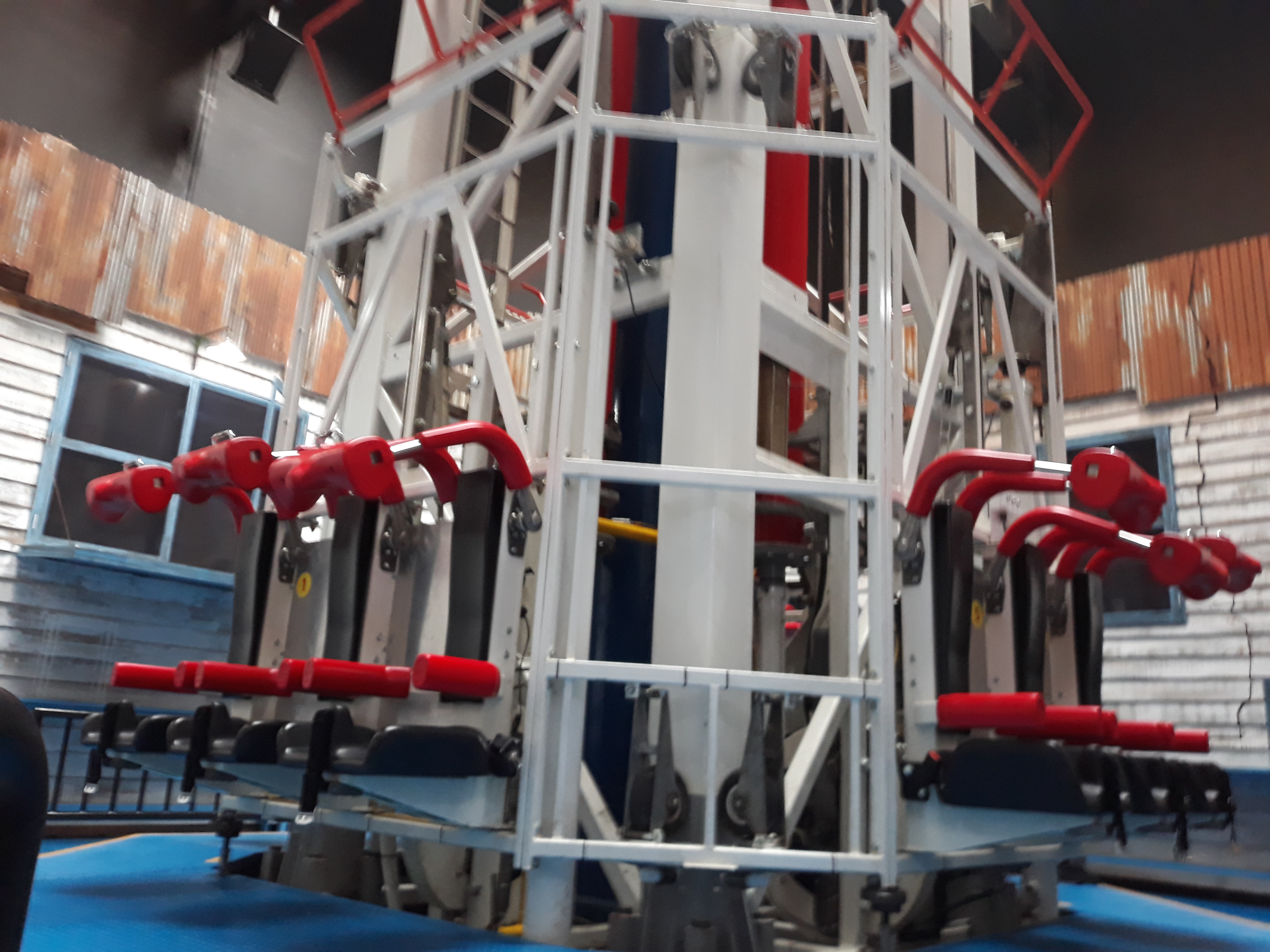 The Pemburu Badai hurricane storm drop tower attraction at Trans Studio Bandung with dramatic indoor special lighting